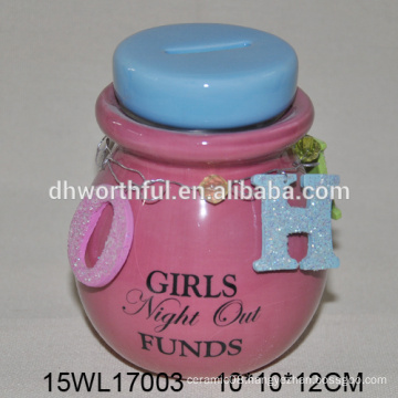 Ceramic coin bank with hanging ornament in bright color